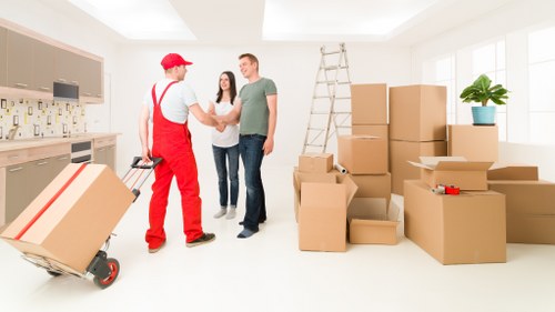Careful wrapping of fragile household items during packing